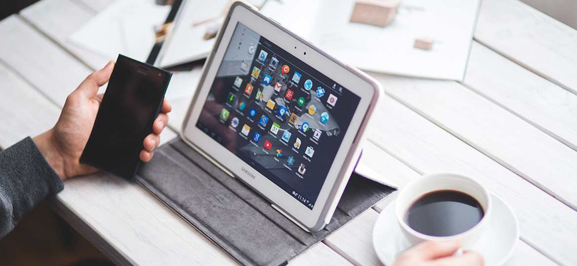 Person Drinking Coffee and Working